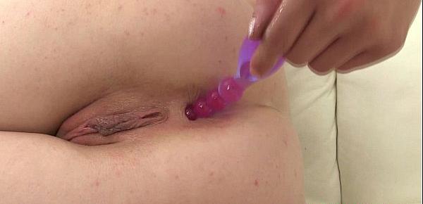  Petite redhead masturbates and uses toy